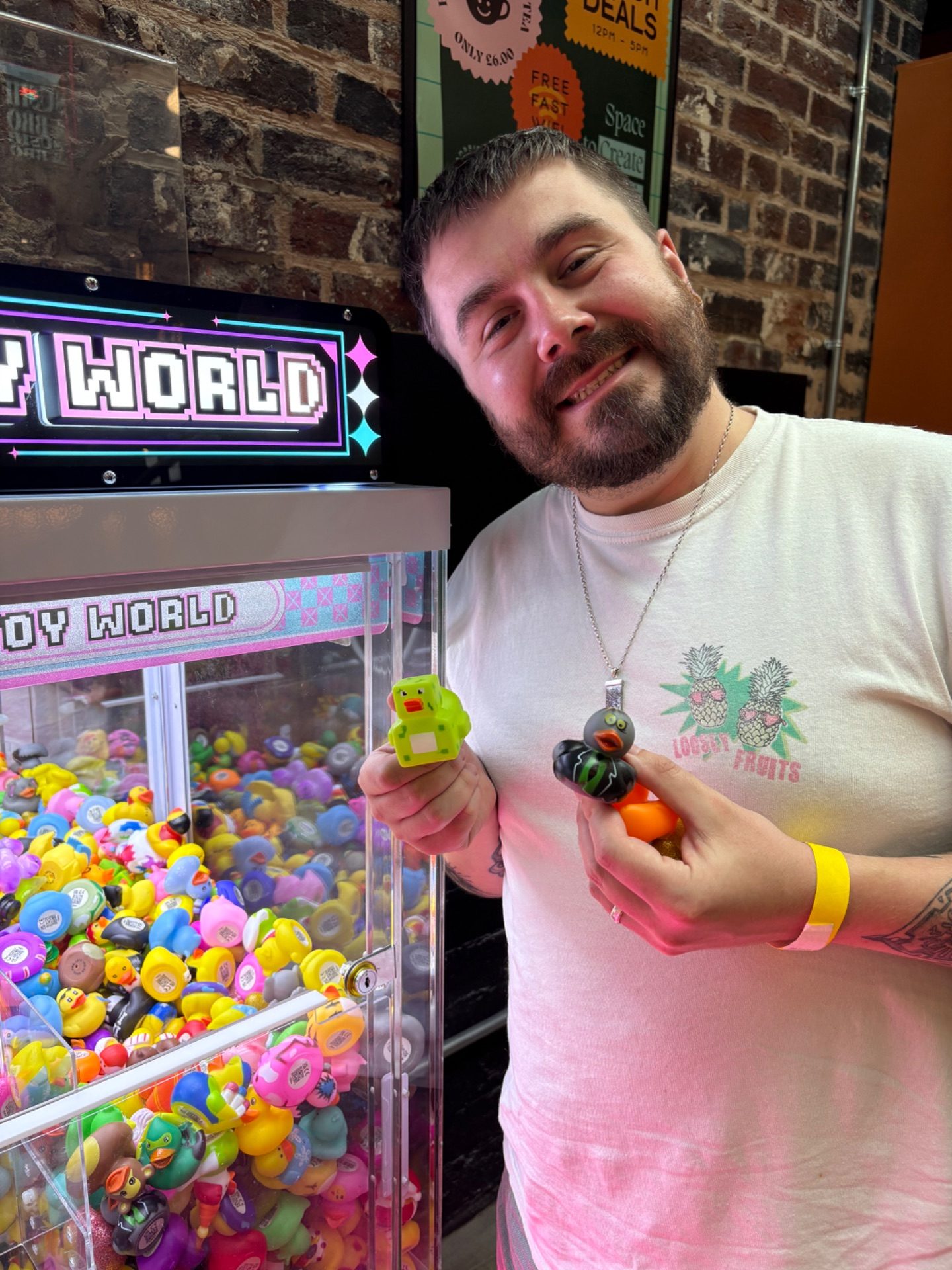 A player holding up two prizes just won